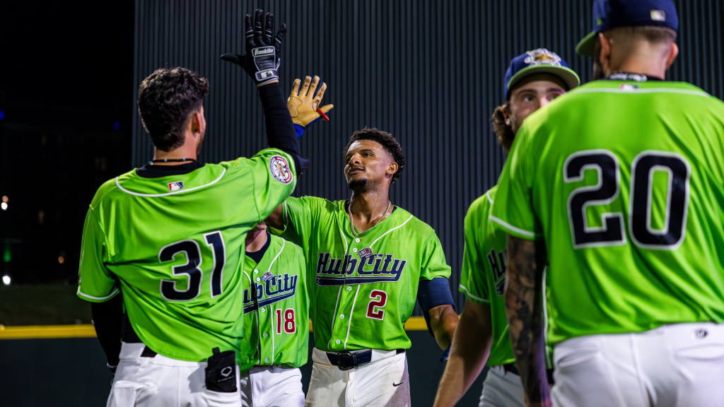 Chandler Pollard receives high-five after walk-off win.