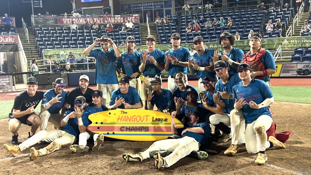 The Kennedy Spacemen celebrate their 2024 Hangout League championship at Blue Wahoos Stadium with the surfboard trophy.