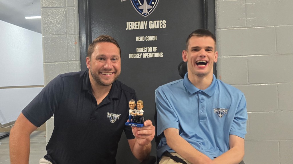 Pensacola Ice Flyers head coach Jeremy Gates visits with Matthew Chestnutt at the Pensacola Bay Center.