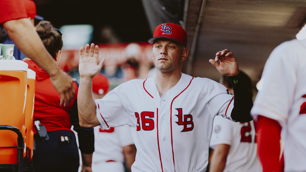 Anthony Misiewicz high-fives teammates after an outing against Iowa.
