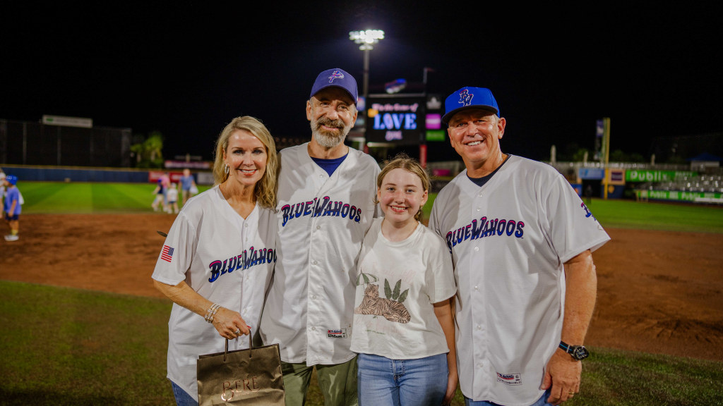 Bere' Jewelers owners Laura and Bary Cole, far left, far right, join with the 2026 winner of the annual Diamond Dig event following the Blue Wahoos' Sept. 12 game.