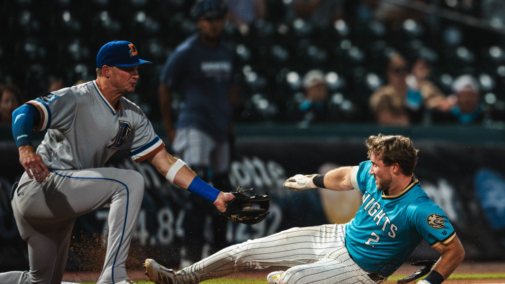 Andy Weber slides safely into third base with a go-ahead two-run triple in Charlotte's 8-5 victory over Durham on Thursday night.