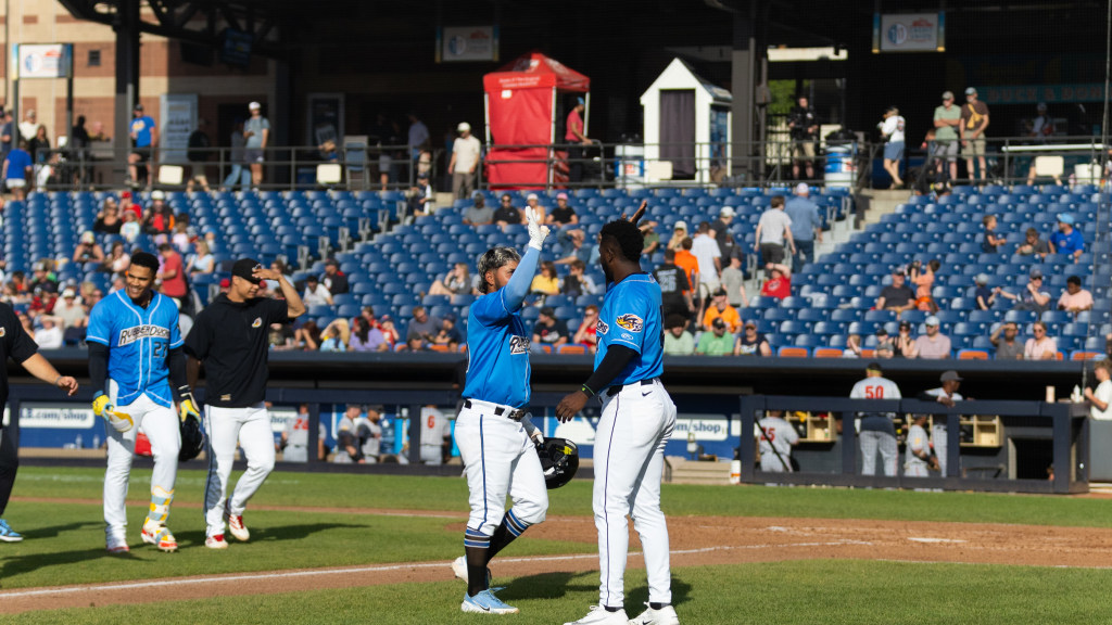 The RubberDucks celebrate the walk-off win of Wednesday's suspended game.