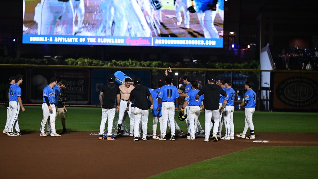 The Akron RubberDucks celebrate Schubart's walk off double in game two