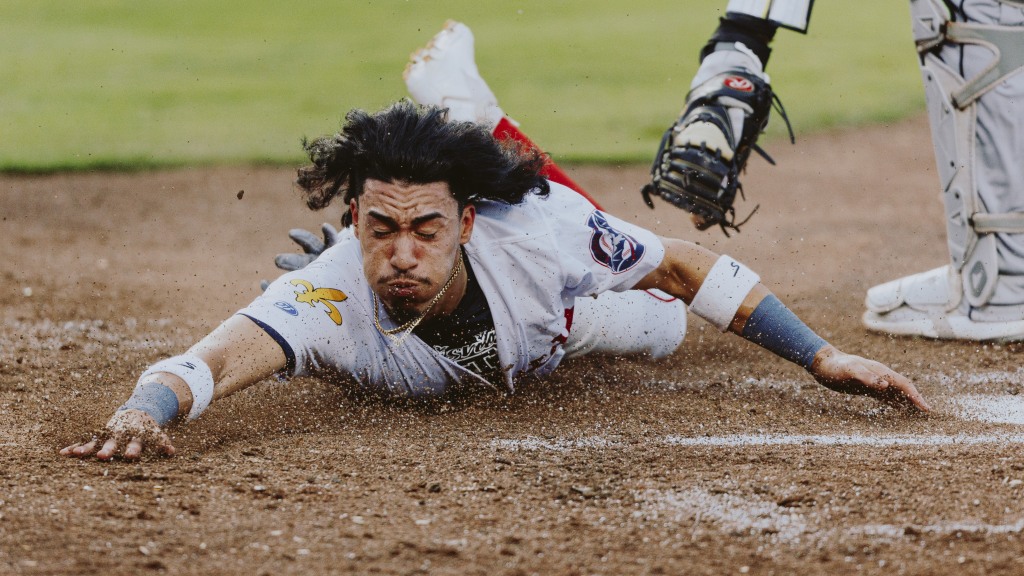 Edwin Arroyo hustled home to score the Bats' first run on Saturday night.