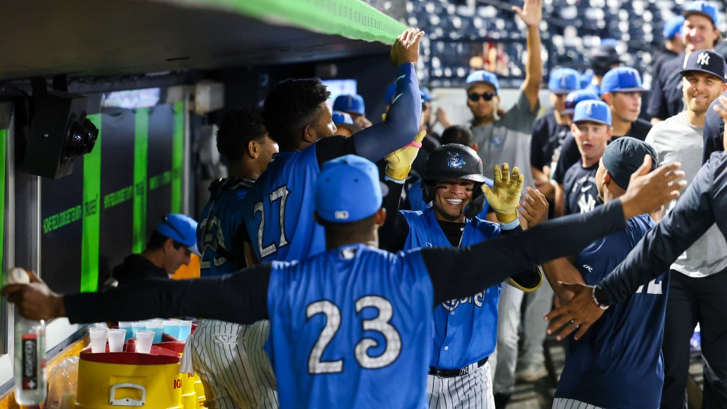 The Tarpons celebrate Ediel Rivera's first homer of the season.