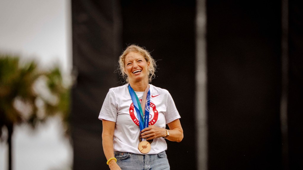 Olympic speedskating medalist Mia Manganello reacts to her ceremonial first pitch May 7 at Blue Wahoos Stadium where the Fort Walton Beach native was honored for her bronze medal.