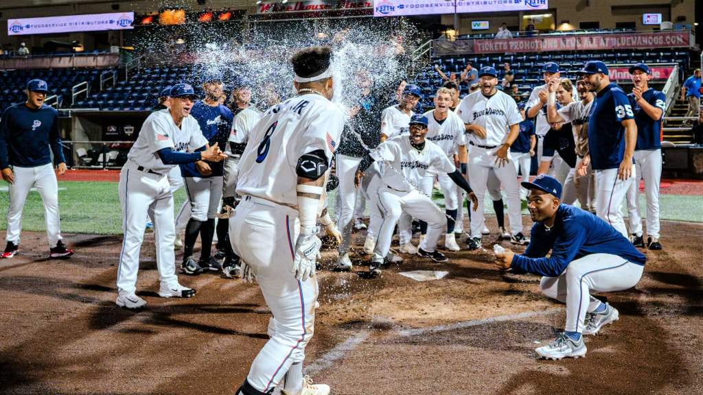 Former Blue Wahoos outfielder Victor Mesa Jr., celebrating in 2023 after walk-off home run, is part of 15 former Blue Wahoos players on 10 different MLB teams in postseason.
