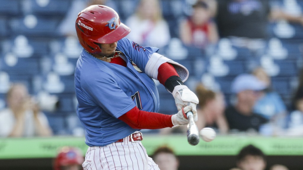 Phillies catching prospect Alirio Ferrebus takes a swing during a Clearwater Threshers game.