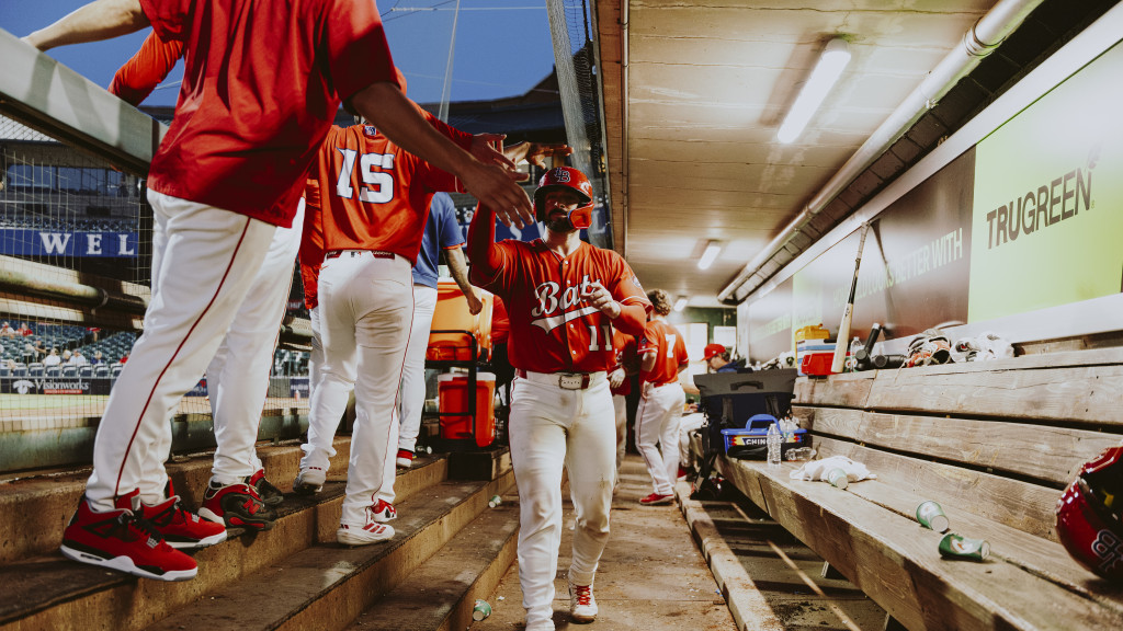 Will Banfield high-fives teammates against Iowa.