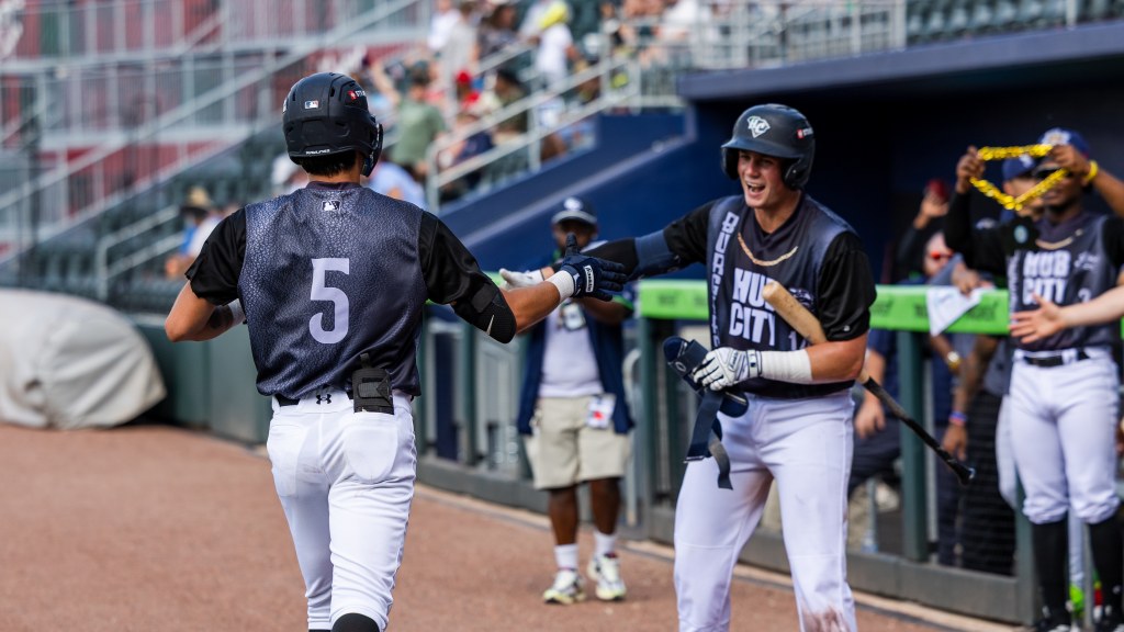 Carter Garate receives congratulations after his grand slam.