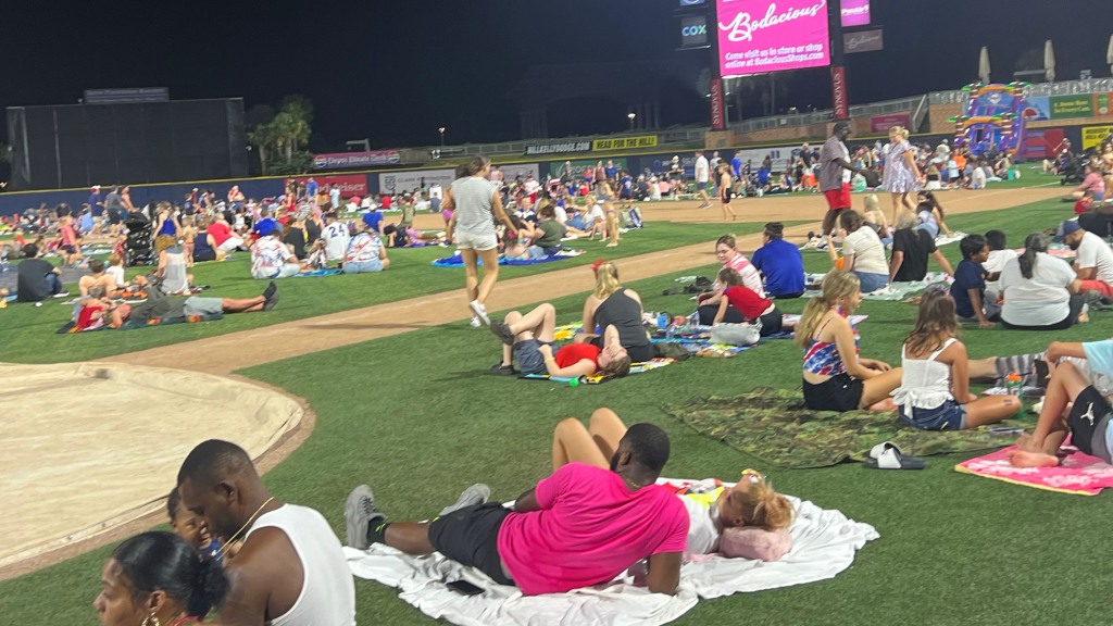 People gather on the field at Blue Wahoos Stadium for a Fourth of July night event. This year, it will happen on July 3-4 to mark nation's 250 birthday.