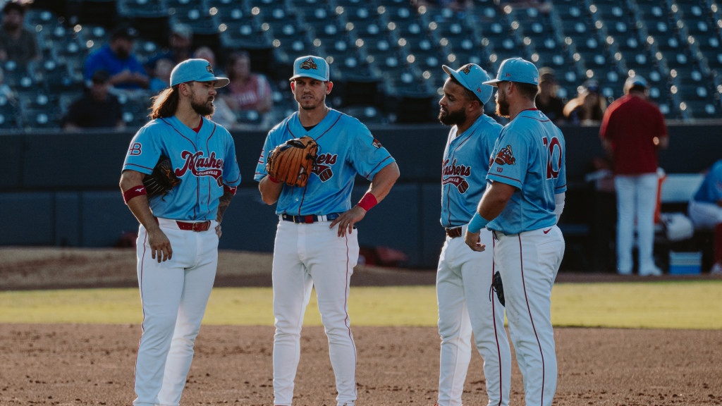 A group of Bats players meets in the infield against Indianapolis.