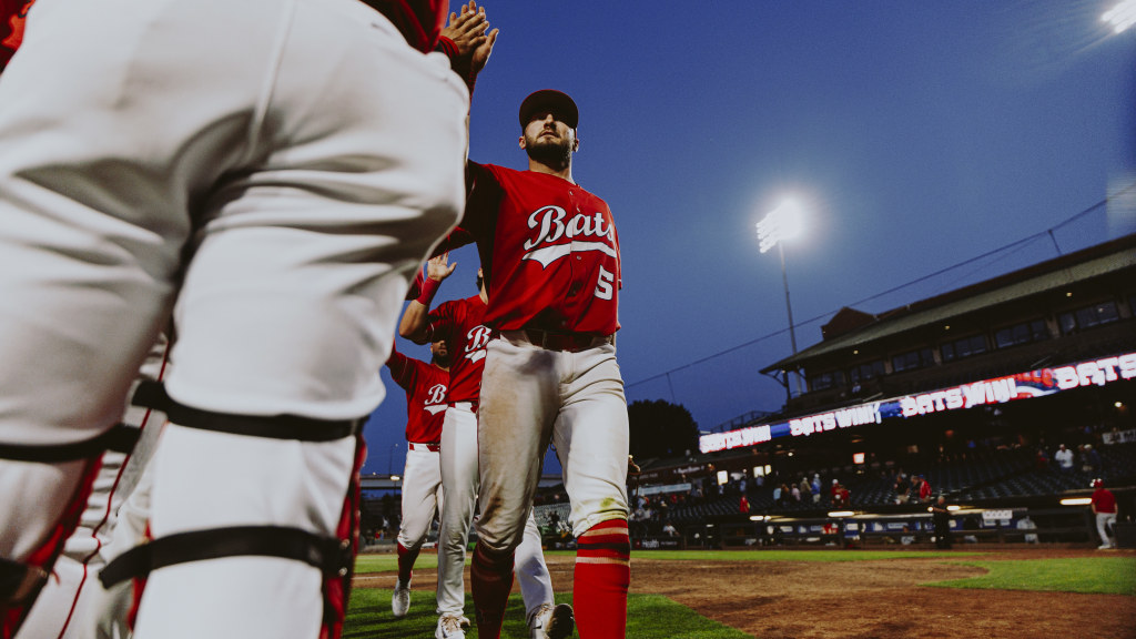 Garrett Hampson walks off Slugger Field after a win.