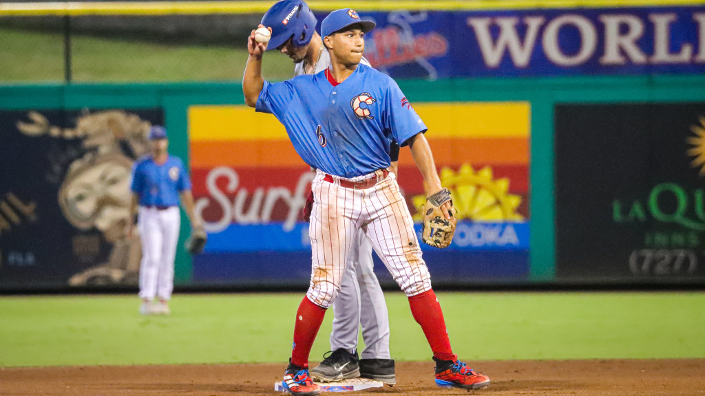 Phillies infield prospect Robert Phelps throws the ball in after making a play at second base.