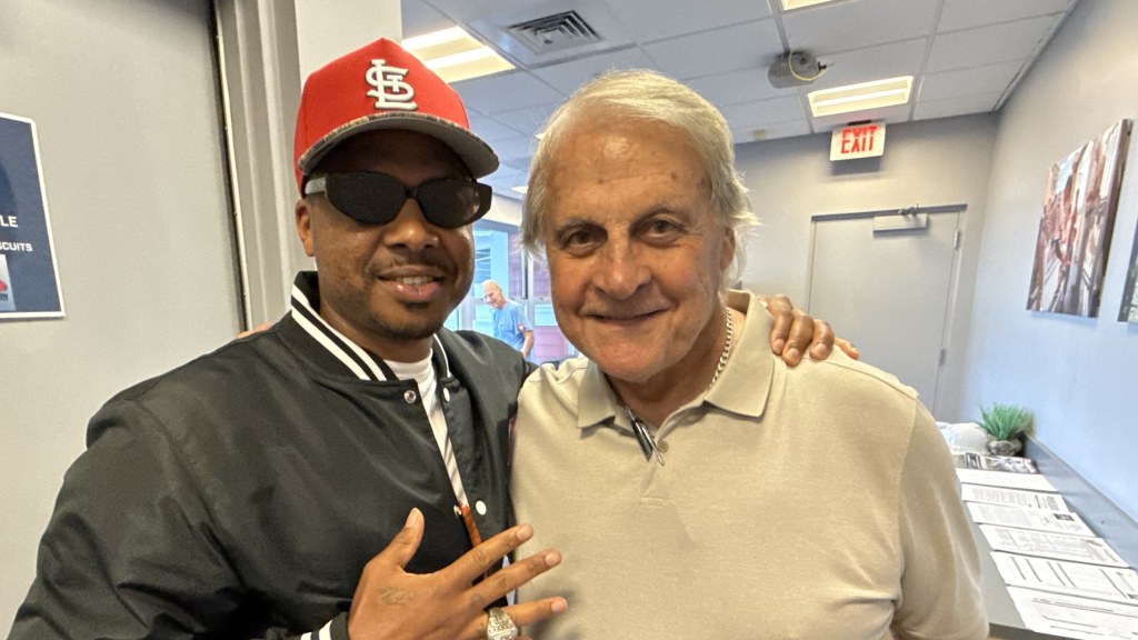 Pensacola's Adron Chambers, member of the St. Louis Cardinals 2011 World Series championship team, reunites with his manager Tony La Russa on June 19 at Blue Wahoos Stadium