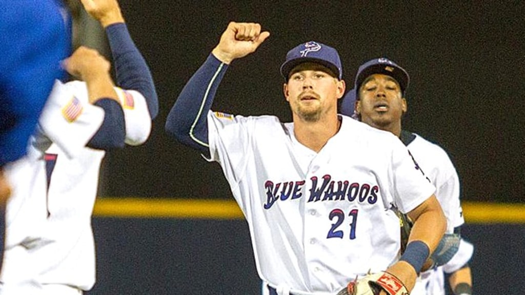 Brian O'Grady (21) celebrates in 2018 with teammates after a Blue Wahoos win. The next season he reached the Major Leagues.