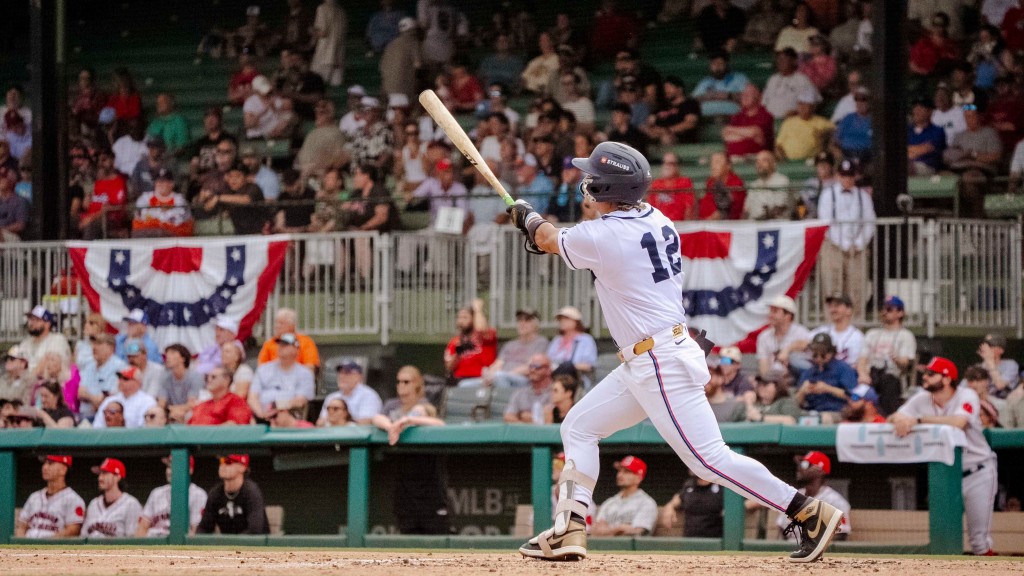 Blue Wahoos newcomer Juan Matheus, who joined the team a day earlier, watches his 3-run home sail out of fabled Rickwood Field on May 27 as part of Pensacola's 23-4 win against Birmingham in The Rickwood Game.