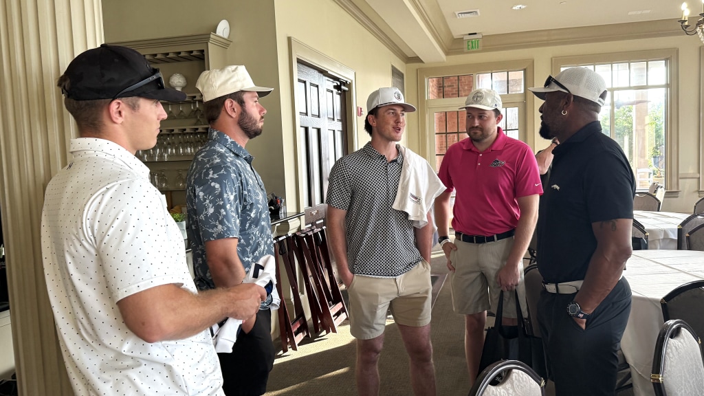 Former MLB great Gary Sheffield, a 9-time All Star, visits with Blue Wahoos players Gabe Bierman, left, Colby Shade, center, and Ethan O'Donnell, along with Blue Wahoos broadcaster Erik Bremer, on August 17, prior to the Derrick Books Charities Classic Golf Tournament.