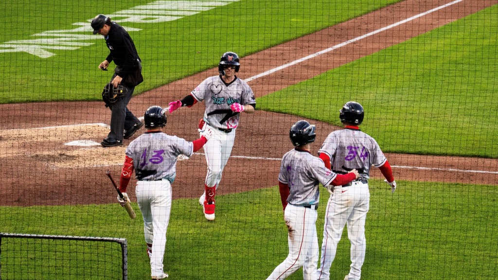 WooSox SS Nick Sogard accepts congratulations after his 3-run HR helped the Worcester Red Sox, wearing their “Art of the Woo” jerseys and caps, defeat the Scranton/Wilkes-Barre RailRiders, 8-3 on Friday night at Polar Park.