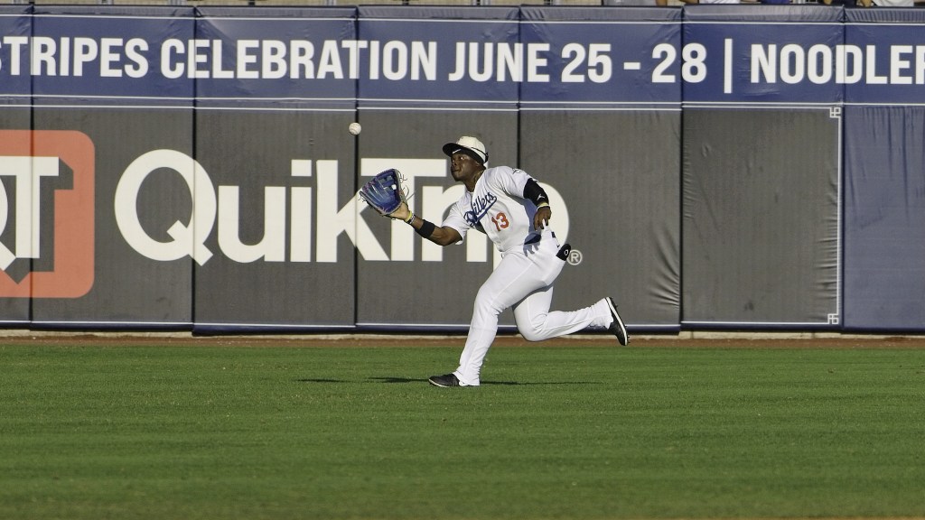 Outfielder Zyhir Hope reaches to make a catch during Tulsa's loss to Corpus Christi on Sunday night.