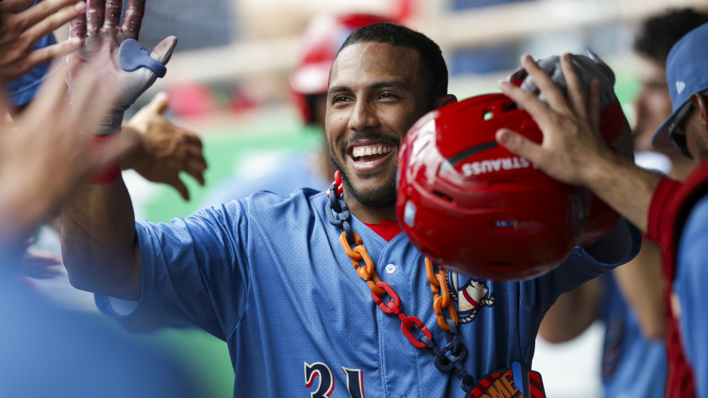 Phillies outfield prospect Pedro León celebrates in the dugout after a home run for the Clearwater Threshers.