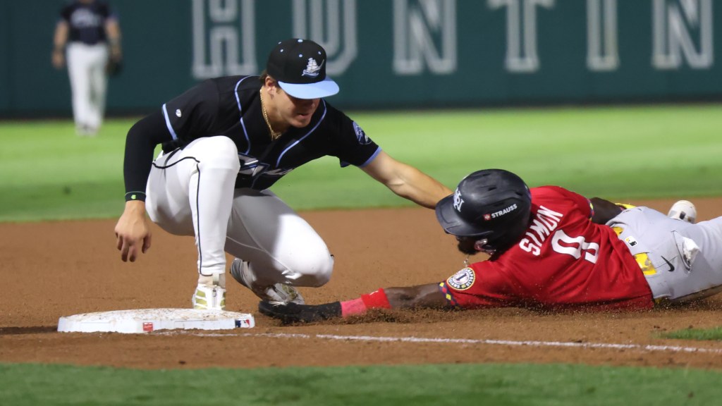 Milan Tolentino tags out Indy's Ronny Simon at third base Saturday at Huntington Park