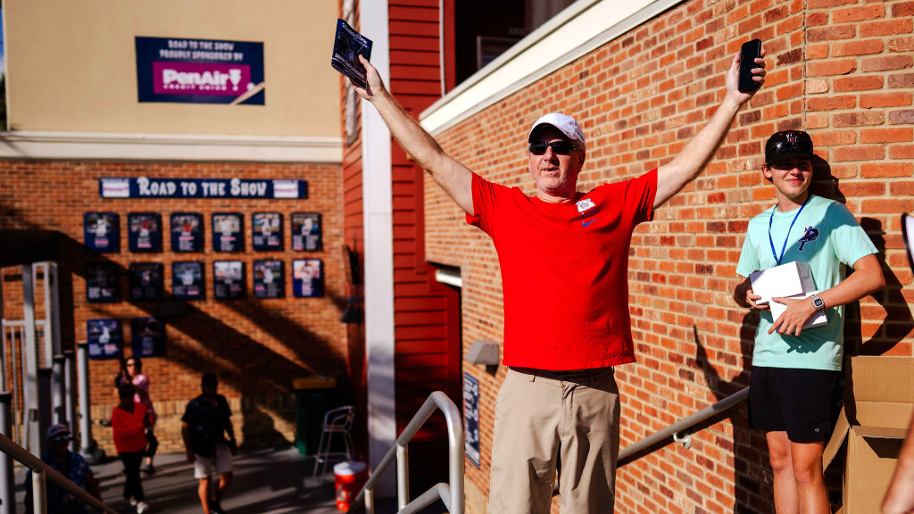 David Stouffer, a Pompano Beach resident visiting his daughter in Pensacola, reacts to being chosen as the Blue Wahoos' four millionth fan in franchise history.