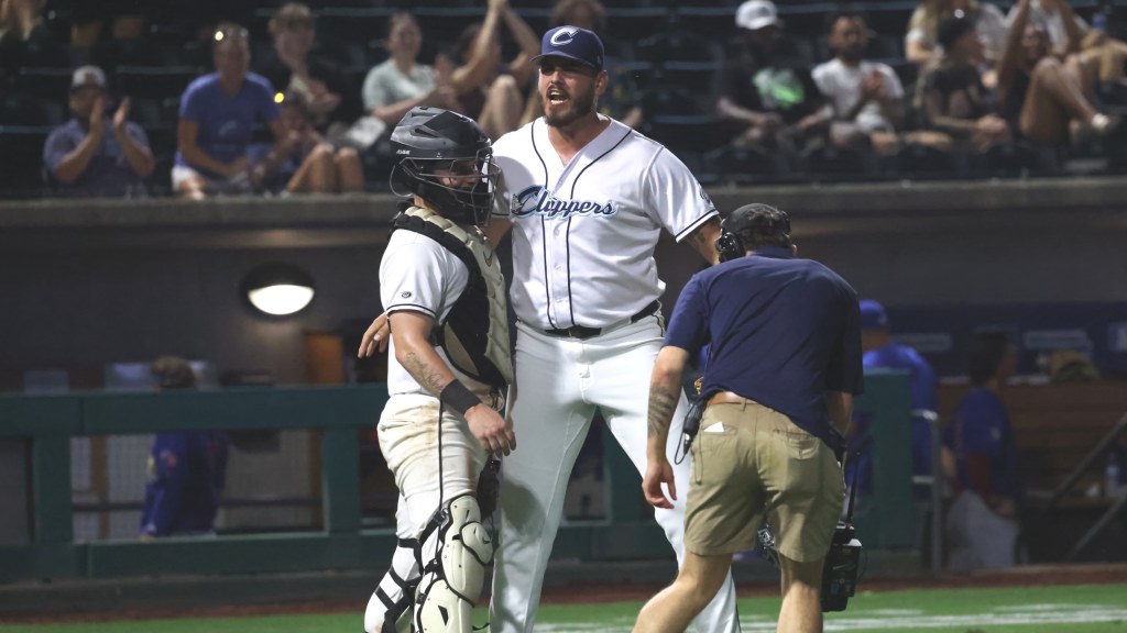 Franco Aleman and Cooper Ingle celebrate after the final out Tuesday night at Huntington Park