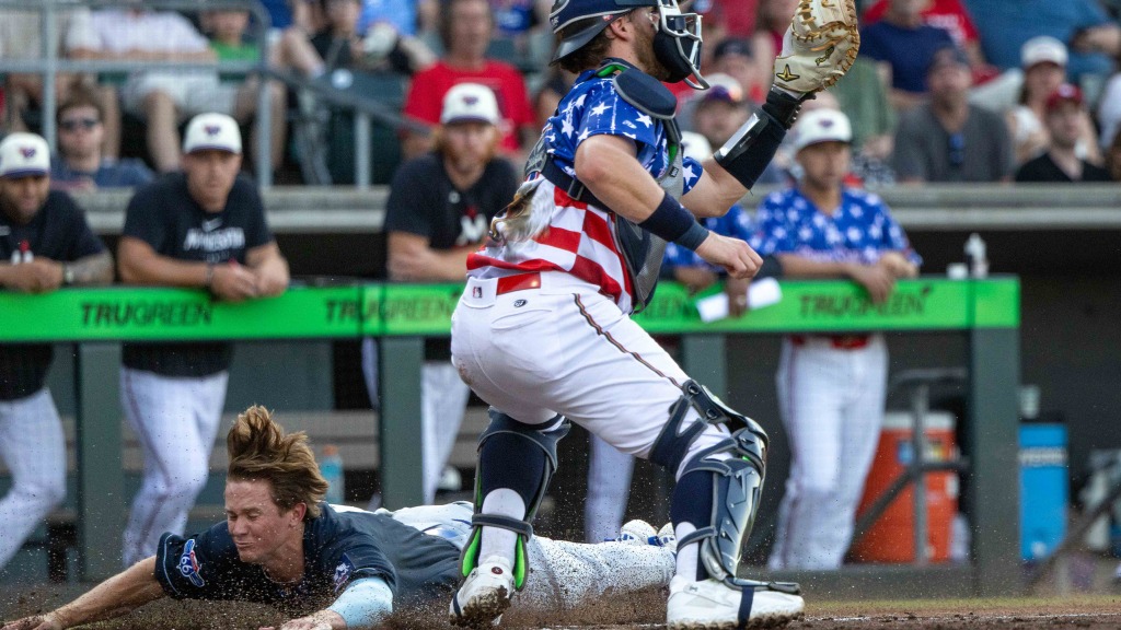 Sean McLain slides home with one of Tulsa's ten runs in its win at Wichita on Friday night.