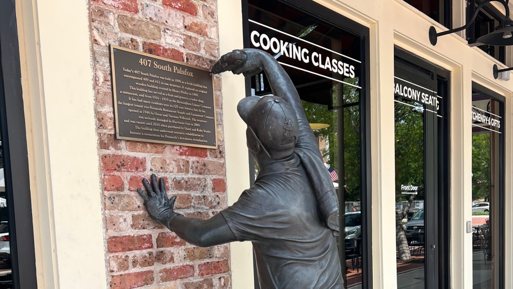 This statue outside the Bodacious Shops in downtown Pensacola is a tribute to Quinton "Quin" Studer, a tradesperson and the father of Blue Wahoos owner Quint Studer.