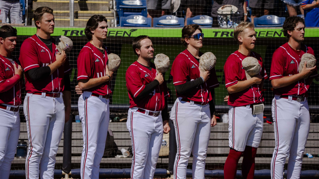 Members of the Troy Trojans baseball team line up for National Anthem prior to Oct. 24 fall exhibition game at Blue Wahoos Stadium.