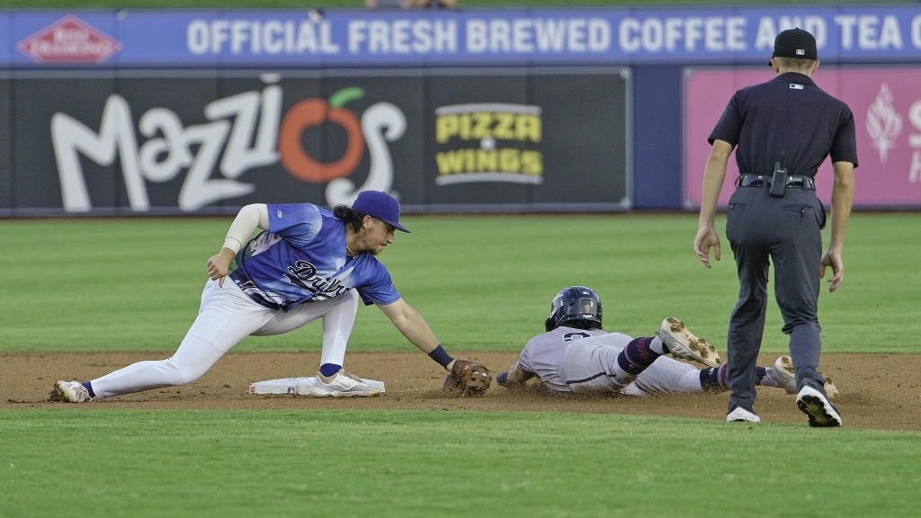 Jake Gelof applies a tag in Tulsa's 8-6 victory over Wichita on Saturday night.