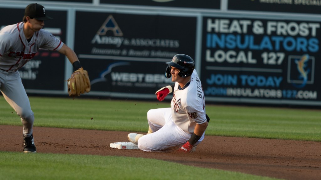 Eric Bitonti slides safely into second in the bottom of the first inning against the Lansing Lugnuts on July 28. Bitonti had two doubles and scored two run in the Wisconsin 7-2 victory.