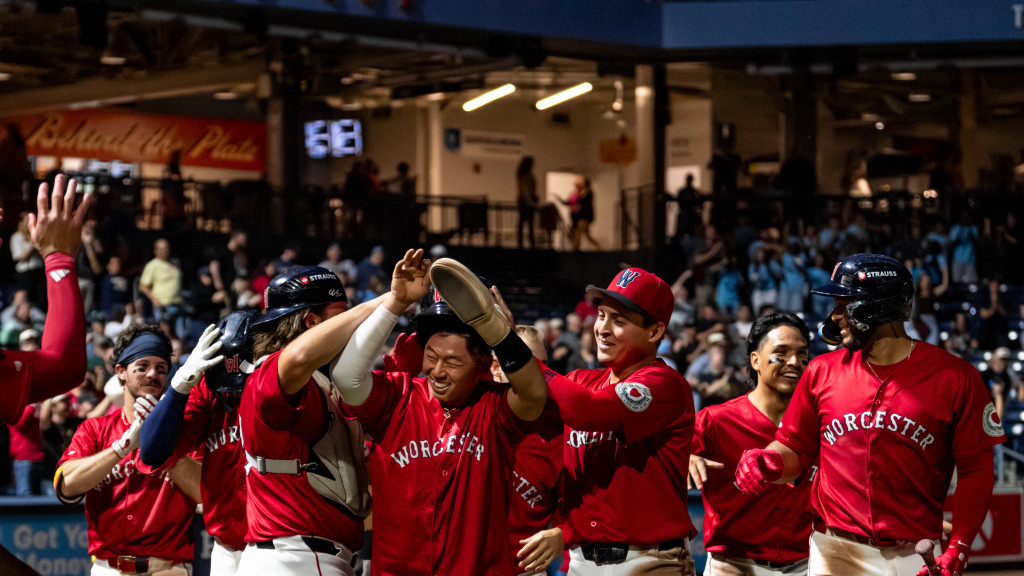 Tsung-Che Cheng is mobbed by teammates after scoring the winning run in Worcester’s, 3-2 walk-off victory over Buffalo on Tuesday night at Polar Park.