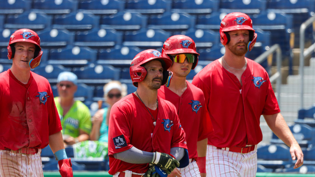 Phillies catching prospect Mark Kolozsvary celebrates a grand slam with his Threshers teammates.