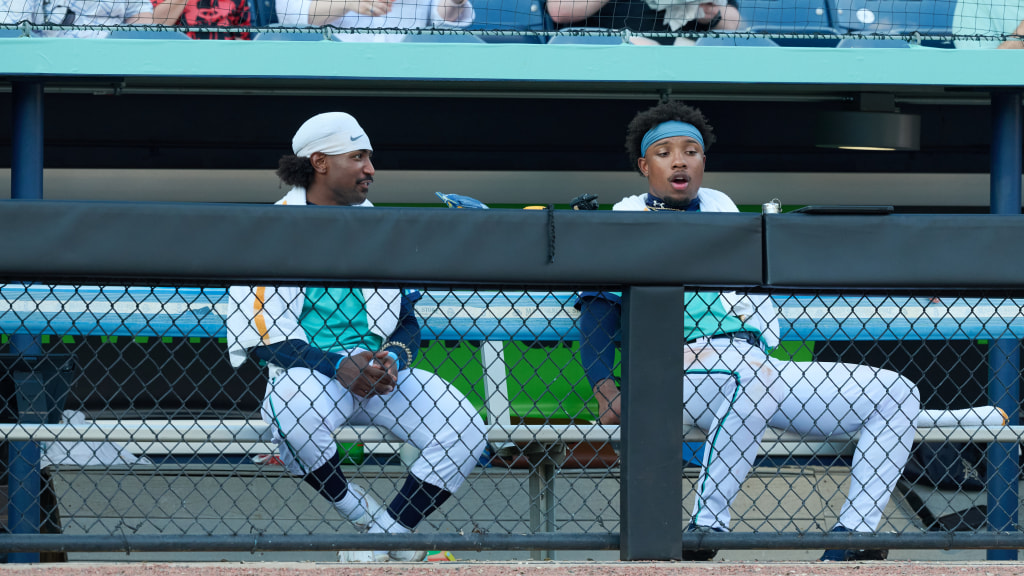 Walker and Thomas chatting in the dugout at HomeTrust Park.
