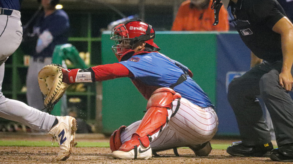 Phillies top catching prospect Alrio Ferrebus fields a pitch behind home plate for the Threshers.