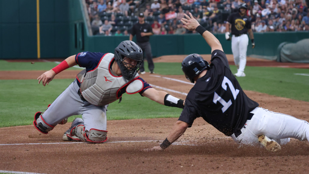 No one knows how Daniel Schneemann managed to slide safely into home in the 5th inning Tuesday