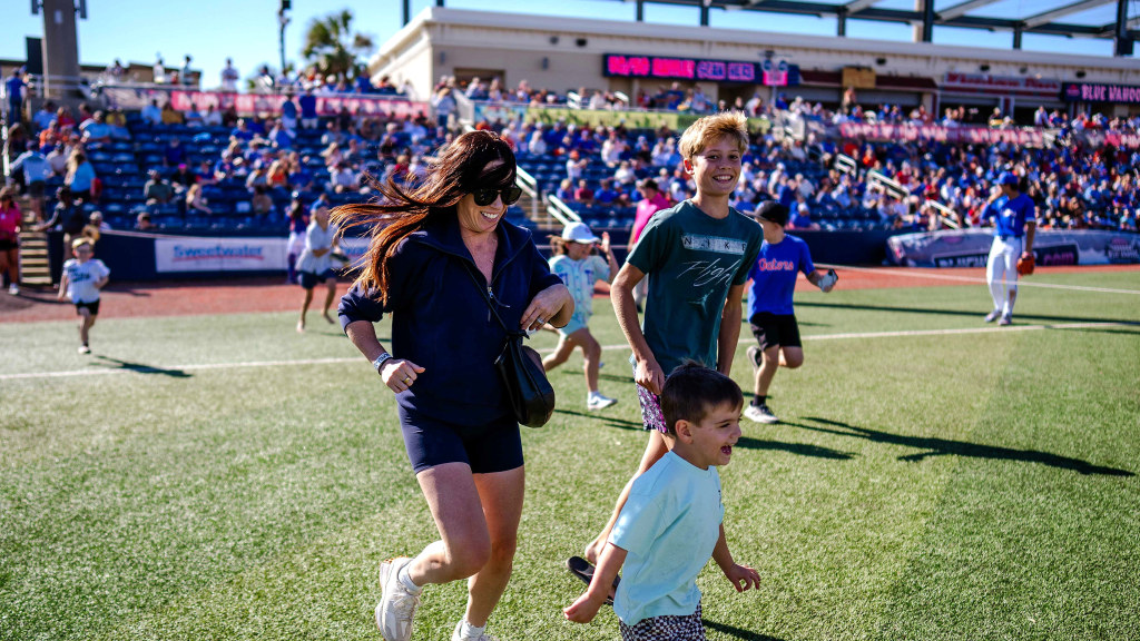 Young fans -- and parents -- hit the field on Oct. 24 for the "Roach Run" during the Florida-Troy fall baseball game at Blue Wahoos Stadium.