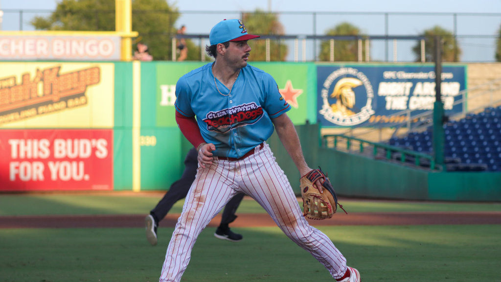 Phillies infield prospect Cade Climie finishes off a play at third during a Beach Dogs game at BayCare Ballpark.