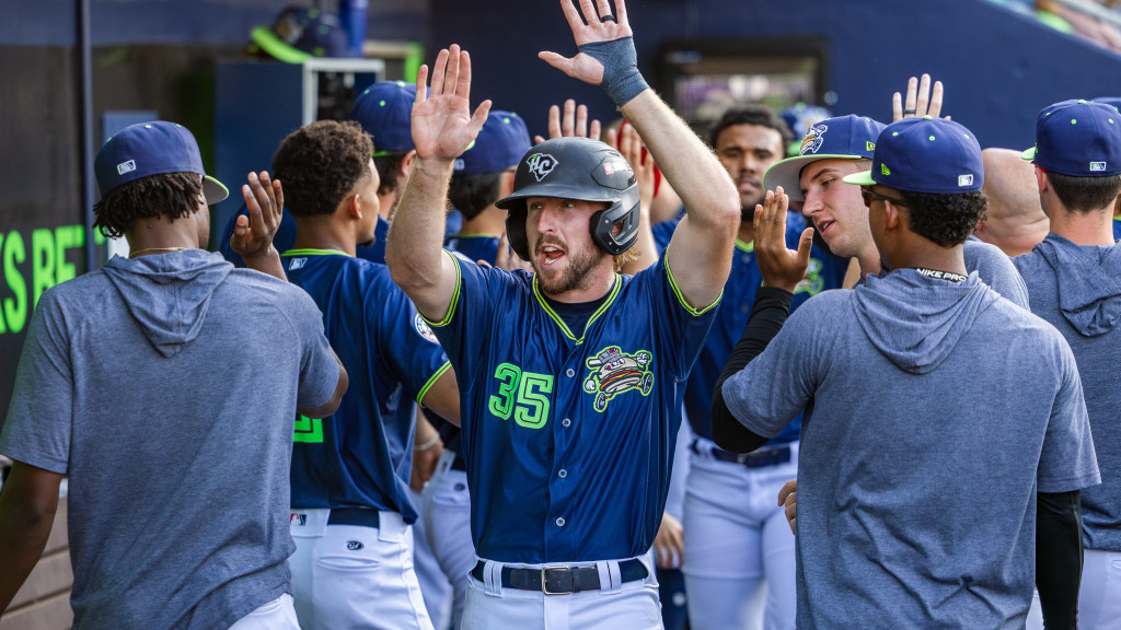 Paxton Kling celebrates in the 'Burgers dugout.