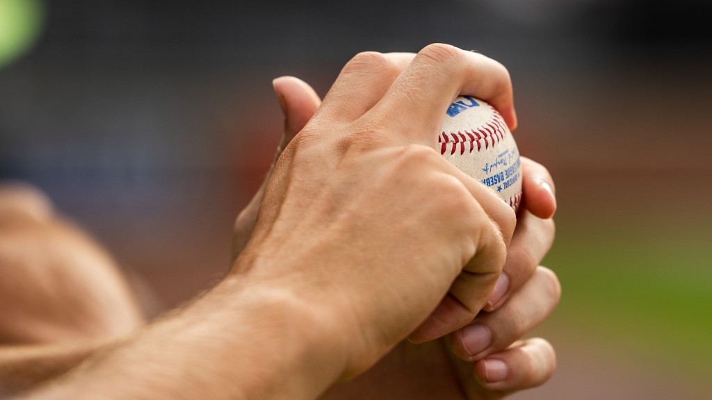 Spartanburgers player holds a baseball.