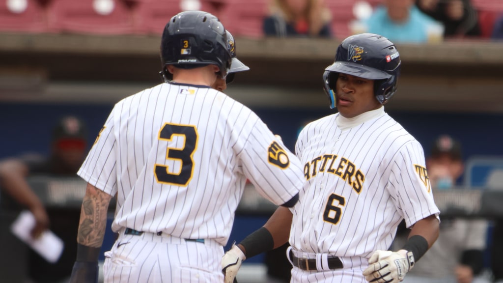 Braylon Payne (6) is greeted at home plate by Daniel Dickinson (3) after hitting a three-run home run in the bottom of the fifth inning on Sunday at Neuroscience Group Field.