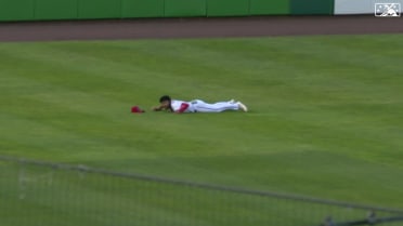 Marcus Lee Sang makes a diving catch in left field