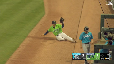 Joshua Fuentes makes a sliding grab in foul territory