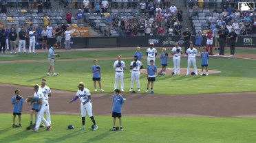 Walker Jenkins helps out young fan before game