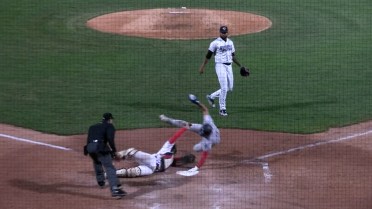 Max Burt's acrobatic slide into home