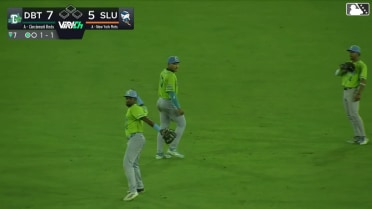 Esmith Pineda makes a sliding backhanded grab