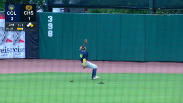 Asbel Gonzalez makes a sliding grab